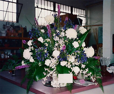 Funeral Arrangement with mums and other flowers