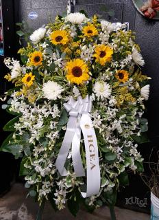 White Standing Spray Accented with Sunflowers